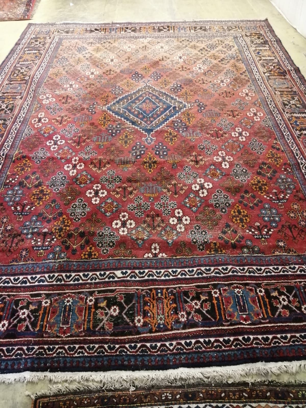 A Hamadan red ground carpet, 422 x 307cm